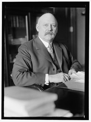 John W. Weeks at desk