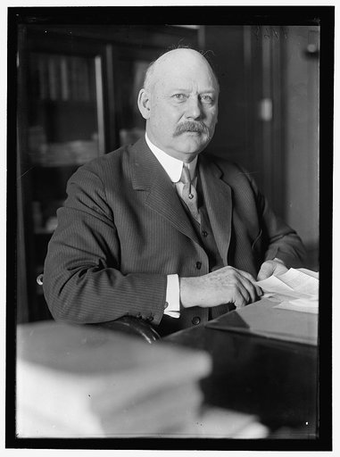 John W. Weeks at desk