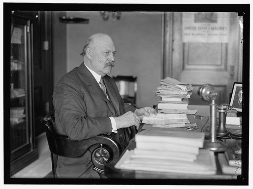 John W. Weeks at desk
