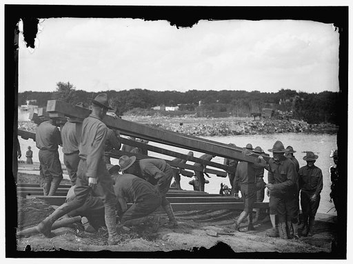 US Army Engineering unit building a pontoon bridge at Washington Barracks, Washington, D.C.
