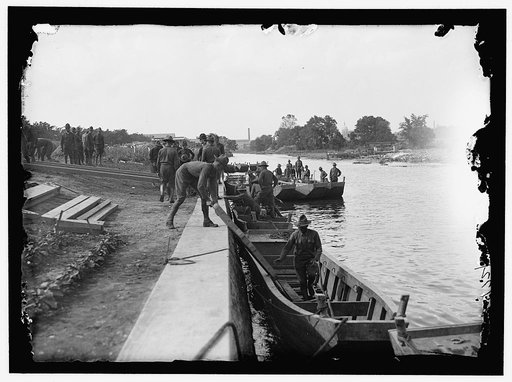 US Army Engineering unit building a pontoon bridge at Washington Barracks, Washington, D.C.