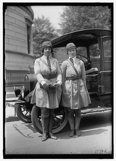 Women in uniform wearing hats with label: "War Camp Community Service"