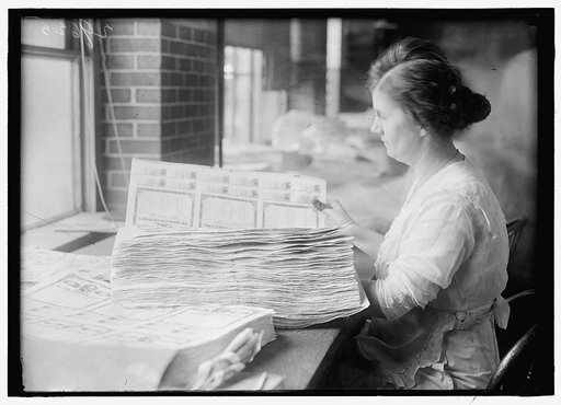 Woman holding $50 bonds, probably Liberty Bonds. Engraving and Printing, Bureau of Treasury Dept.