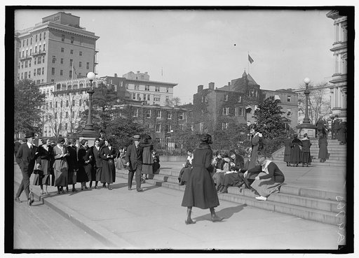 Pedestrians, on steps of southwest corner of the State, War, & Navy Building, with the 500 block of 17th Street, N.W., behind, Washington, D.C.