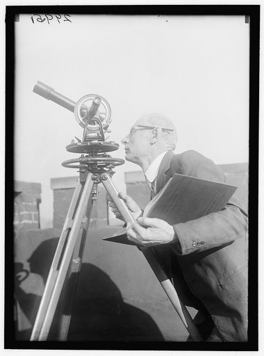 MAN AT TELESCOPE