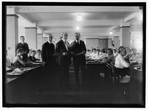Charles Evans Hughes, center