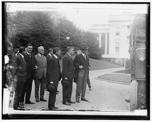 Group outside White House: includes Woodrow Wilson (right), and Newton Baker (2nd from right)
