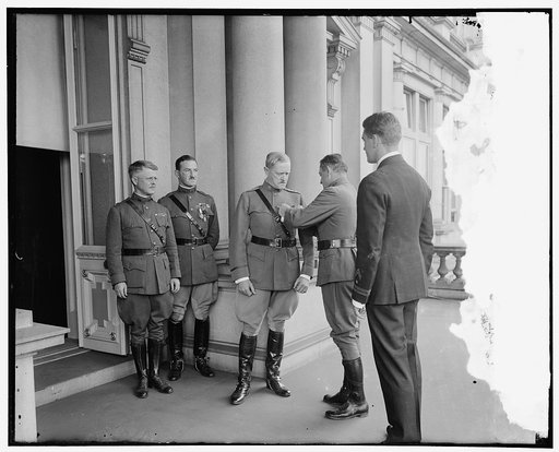 Gen'l Pershing being decorated with American Legion Medal