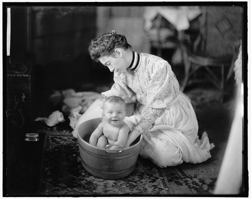 HARRIS, MARTHA. BABY BEING WASHED