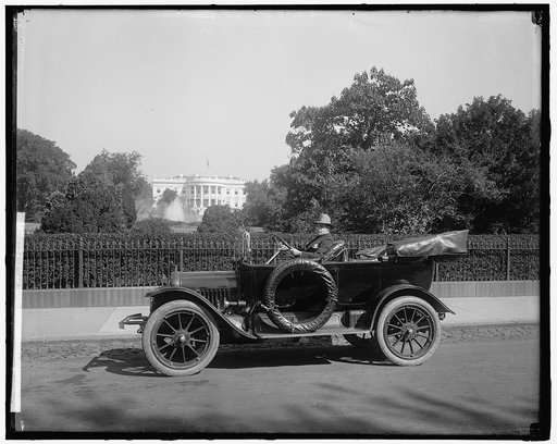 NICHOLSON, SOTERIOS. IN AUTO [White House in background