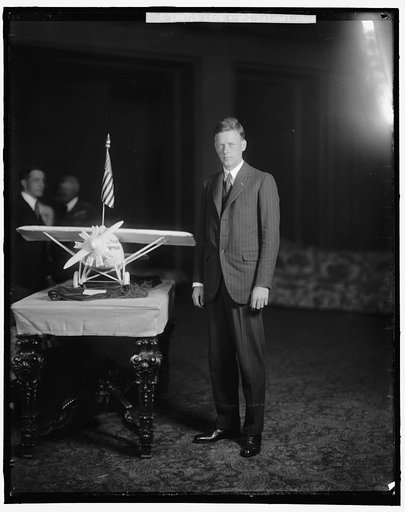 LINDBERGH, CHARLES, COLONEL. WITH PLANE MODEL