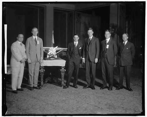 LINDBERGH, CHARLES, COLONEL. GROUP WITH MODEL
