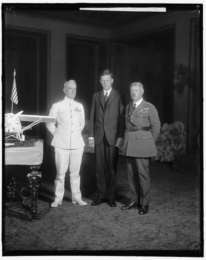 LINDBERGH, CHARLES, COLONEL. GROUP WITH MODEL
