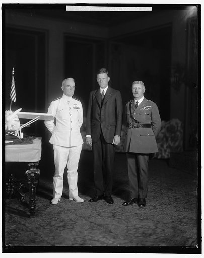 LINDBERGH, CHARLES, COLONEL. GROUP WITH MODEL