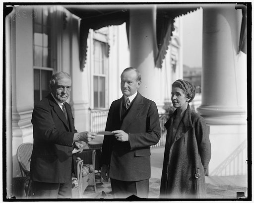President and Mrs. Coolidge enrolled in American Red Cross by Judge John Barton Payne. The twelfth annual roll call of the American Red Cross was officially opened in Washington today when President and Mrs. Coolidge were enrolled for their annual memberships by Judge John Barton Payne, chairman of 