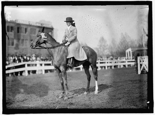 Martha Anne Scott Hazard at the National Capital Horse Show 1911, May 4-6. Building in back is Frazee Potomac Laundry, 18th Street and D Street, N.W., Washington, D.C. (NW Corner)