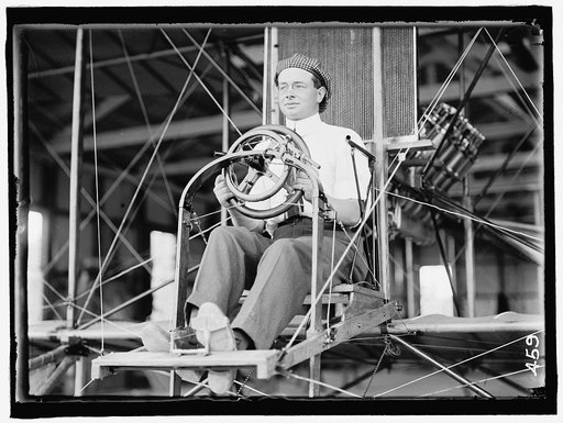 PECK, PAUL. COMMERCIAL AVIATOR. IN CURTISS TYPE PLANE; COLLEGE PARK