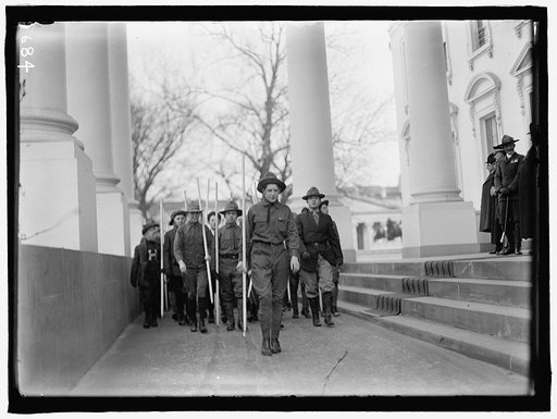 BOY SCOUTS. VISIT OF SIR ROBERT BADEN-POWELL TO D.C. REVIEWING PARADE FROM WHITE HOUSE PORTICO