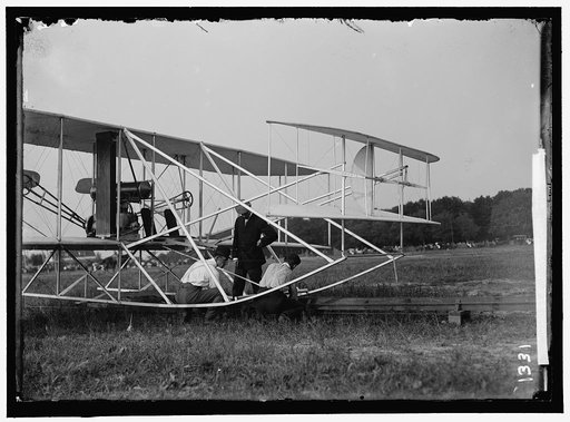 WRIGHT FLIGHTS, FORT MYER, VA, JULY 1909. FIRST ARMY FLIGHTS; WILBUR AND ORVILLE WRIGHT, CHARLIE TAYLOR; PUTTING PLANE ON LAUNCHING RAIL