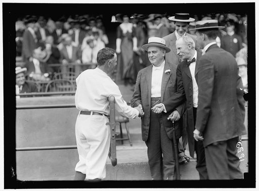 BASEBALL, PROFESSIONAL. CHAMP CLARK SHAKING HANDS WITH CLARK GRIFFITH