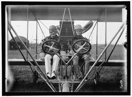 AVIATION, NAVY. COMMODORE J.C. GILLMORE IN CURTISS HEADLESS PLANE, DUAL CONTROL, AT COLLEGE PARK ARMY FLYING FIELD, LT. MILLING, RIGHT