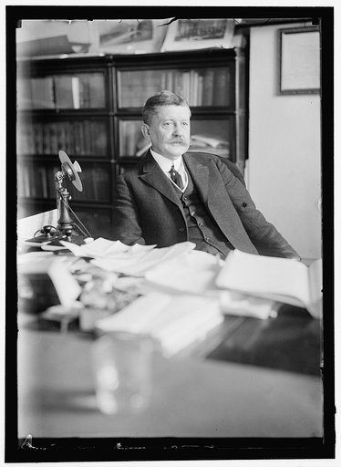 MOORE, EDWARD B. COMMISSIONER OF PATENTS. AT DESK