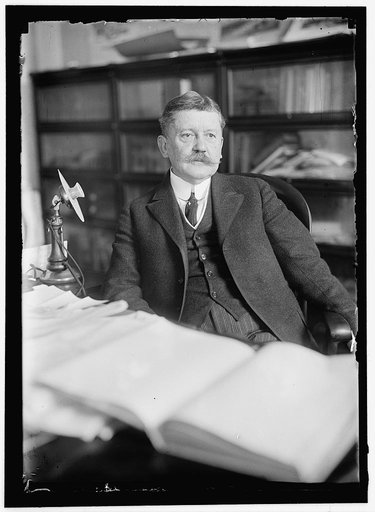 MOORE, EDWARD B. COMMISSIONER OF PATENTS. AT DESK