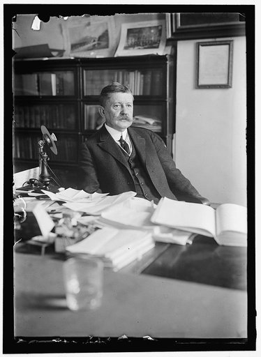 MOORE, EDWARD B. COMMISSIONER OF PATENTS. AT DESK