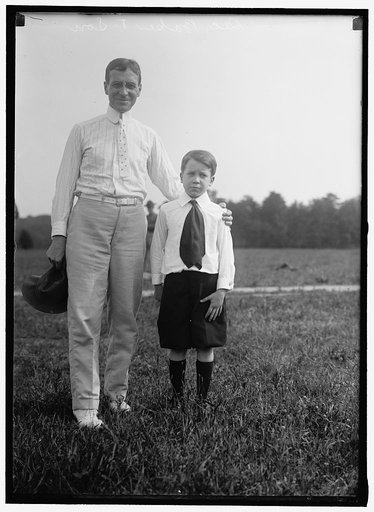 BAKER, NEWTON DIEHL. SECRETARY OF WAR, 1916-1921. WITH SON