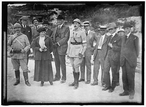 RHEIMS. AMERICAN WAR CORRESPONDENTS: FRENCH OFFICER; MRS. HARRIET C. ADAMS; PAUL CRAVATH; CAPT. PAUL DUMAS, WEARING ARTIFICIAL HAND ANDARM; UNIDENTIFIED; CHARLES EDWARD RUSSELL; UNIDENTIFIED; JUDGE ROBERT GRANT