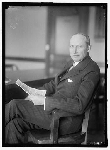COFFIN, HOWARD EARLE. AT DESK