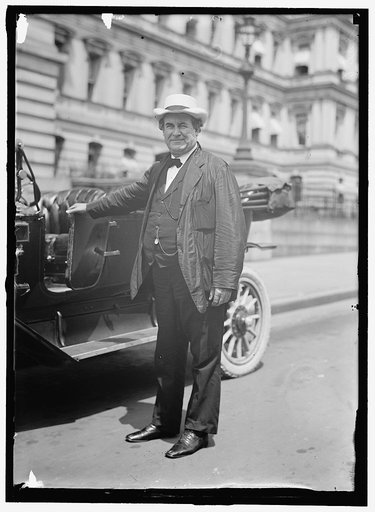 BRYAN, WILLIAM JENNINGS. REP. FROM NEBRASKA, 1891-1895; SECRETARY OF STATE, 1913-1915. STANDING BESIDE AUTO