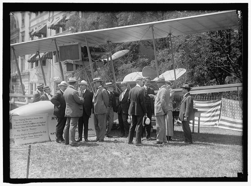 NATIONAL AERO COAST PATROL COMMN. CURTISS HYDROAEROPLANE OR FLYING BOAT EXHIBITED NEAR HOUSE OFFICE BUILDING. REP. KAHN; UNIDENTIFIED; ASST. SEC. INGRAHAM; ADM. PEARY; REP. LIEB; PROF. FRANKENFIELD; BOWMAN; TAYLOR; NEWTON; SMITH. UNIDENTIFIED MAN, BACK TURNED RIGHT OF KAHN