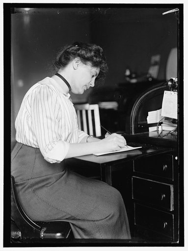 SHELDON, MISS CAROLYN B. AT DESK