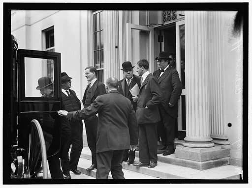 LANE, FRANKLIN K. INTERSTATE COM. COMMR., 1905-1913. SEC. OF INTERIOR, 1913- 1920.WITH PAPER IN HAND, IN CROWD OF NEWSMEN