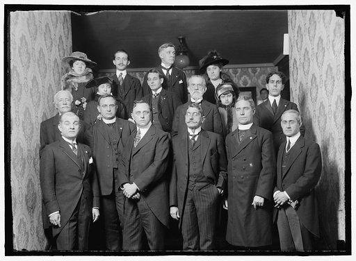 BARRETT, JOHN. DIRECTOR GENERAL, PAN AMERICAN UNION, 1907-1920. UNIDENTIFIED GROUP ON ENTRANCE STAIRWAY OF HIS RESIDENCE; 12 MEN, 3 WOMEN, CHILD