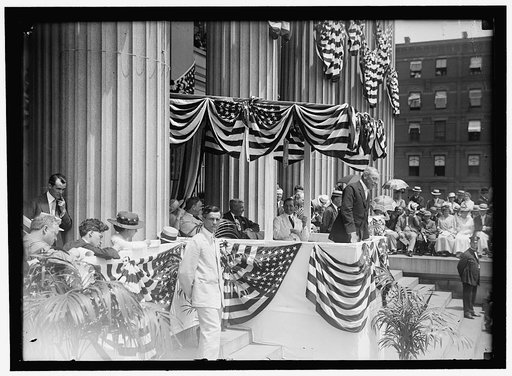 LIBERTY LOANS. WILSON SPEAKING. SEATED: DANIELS; McADOO; LANSING