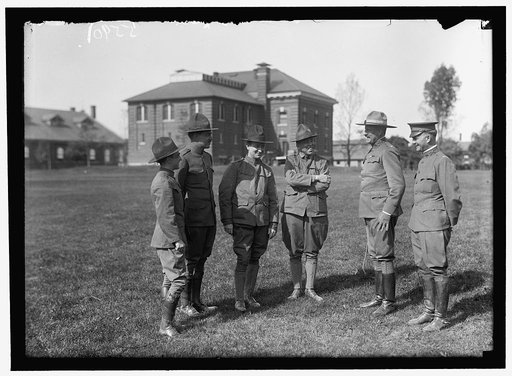PLATTSBURG RESERVE OFFICERS TRAINING CAMP. REGULAR ARMY OFFICERS IN COMMAN, RIGHT, TALKING TO SOME D.C. MAN