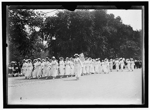 PREPAREDNESS PARADE. MANY WOMEN CARRYING HUGE FLAG