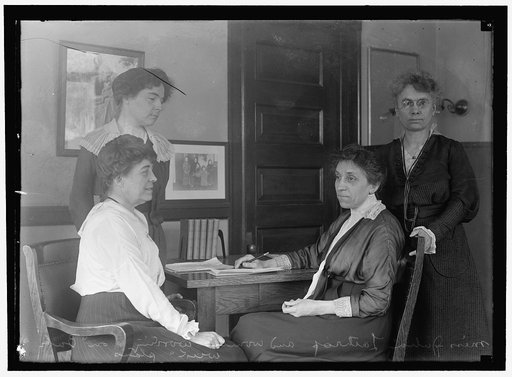LATHROP, JULIA. HEAD OF CHILDREN'S BUREAU, LABOR DEPT. WITH ASSISTANTS; 'BABY WEEK' PLANS