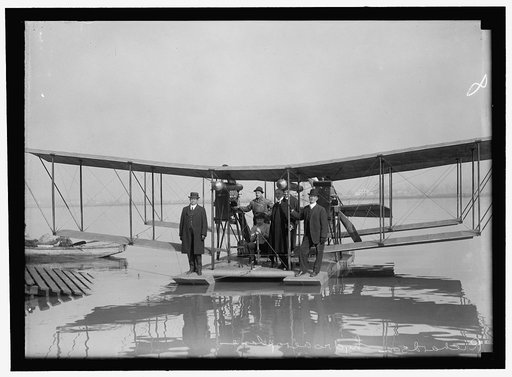 RICHARDSON TANDEM BIPLANE HYDROPLAN ON POTOMAC, APRIL, 1916. GEORGE A. GRAY AT CONTROLS. AT LEFT AND RIGHT ARE RICHARDSON BROTHERS WHO BUILT THE PLANE; 2ND FROM LEFT IS THEIR UNCLE, WHOSE IDEA IT WAS