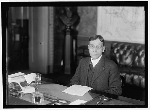 BAKER, NEWTON DIEHL. SECRETARY OF WAR, 1916-1921. AT DESK