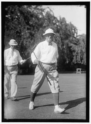 PLAYING GOLF