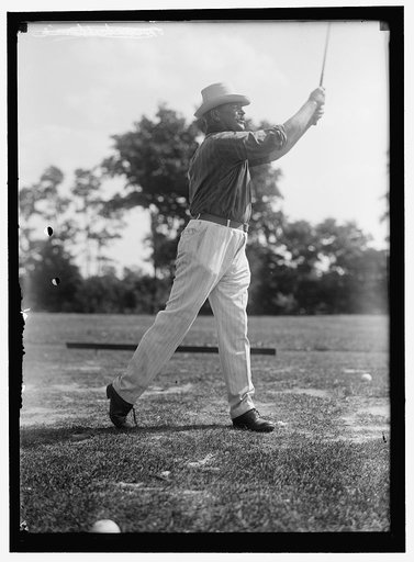 PLAYING GOLF