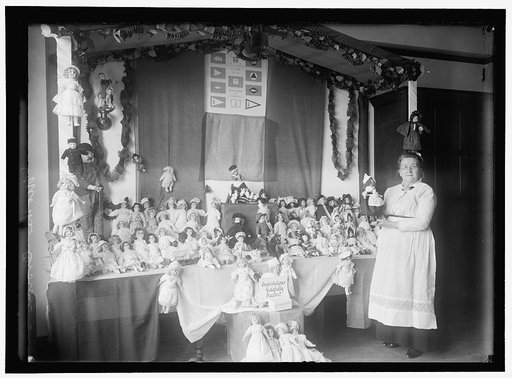 CROWN 'MOTHER' WITH EXHIBIT OF DOLLS