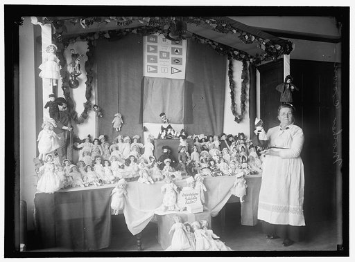 CROWN 'MOTHER' WITH EXHIBIT OF DOLLS