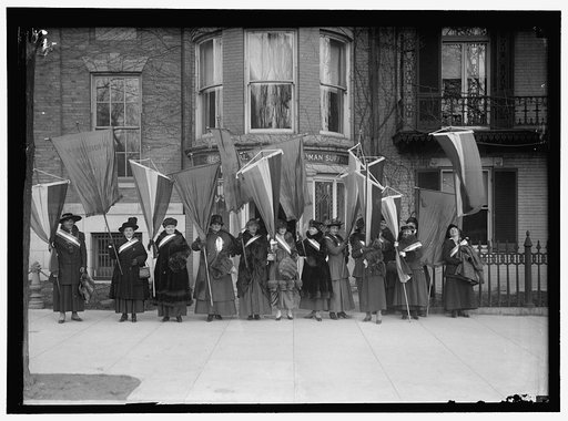 WOMAN SUFFRAGE. LEAVING HEADQUARTERS WITH BANNERS