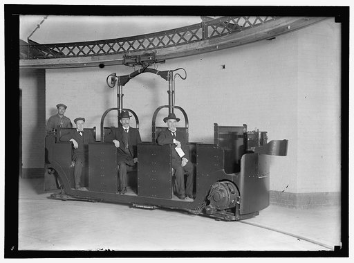 MONORAIL SUBWAY, CAPITOL TO SENATE. THE CAR. SENATORS SWANSON AND TOWNSEND AS PASSENGERS