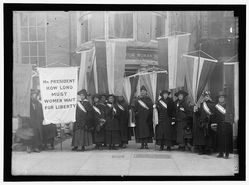 WOMAN SUFFRAGE GROUP LEAVING HEADQUARTERS