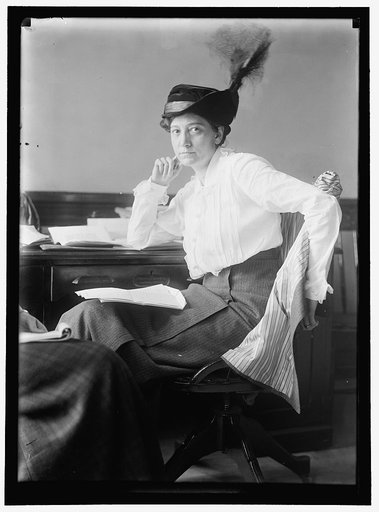 McCORMICK, MRS. MEDILL (RUTH HANNA) AT DESK